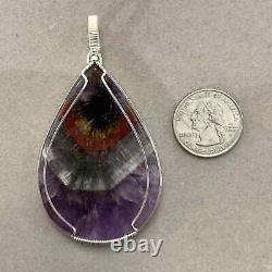 Super 7 ('Soulite') pendant (w red, gold, clear, and purple) healing crystal